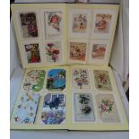 A postcard album containing Mabel Lucie Attwell, Louis Wain and other examples - sold with an