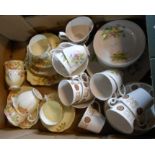 A box containing a Royal Albert part tea set in the Flowers of the Month pattern and two other