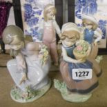 Four Lladro figures three depicting children picking flowers, the other a young girl feeding ducks -