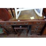 A 1.22m reproduction mahogany twin pedestal desk with inset top, three frieze drawers and flanking