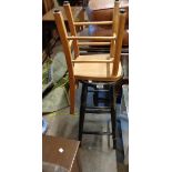 An old stained wood bar stool with ring turned supports - sold with a vintage child's school chair