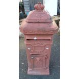 A vintage grand pillar post box with original pink paint and lockable door