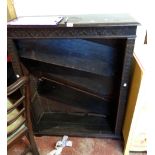 A 91cm late Victorian stained oak four shelf open bookcase with carved detail, set on bracket feet