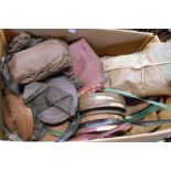 A box containing old leather and upholsterer's tape, etc.