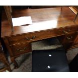 A 100cm 20th Century mahogany kneehole dressing table with long frieze drawer and flanking short