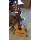 A Tanglewood TC0-CE electro-classical guitar and stand