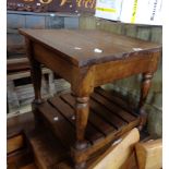 A stained walnut tea table with slatted undertier and turned supports