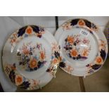 A pair of 19th Century Davenport stone china plates decorated with an Imari pattern