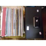 A box containing mostly classical music LP records - sold with a record case containing a quantity