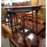 A 61cm Edwardian walnut octagonal topped occasional table, set on turned supports with fretwork