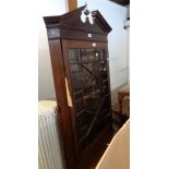 An 80cm 19th Century mahogany wall hanging corner cabinet with scalloped shelves enclosed by an