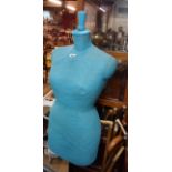 A vintage dressmaker's mannequin on stand by Stockman of Paris and London with original blue