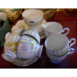 A Gladstone china Art Deco part tea service comprising six trios, milk and sugar and bread and