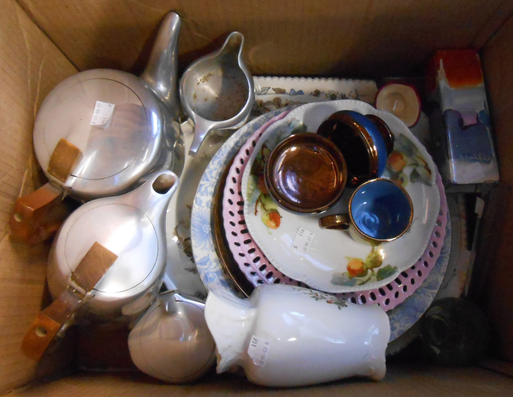 A box containing a quantity of ceramic and glass items including Doulton miniature character jug,