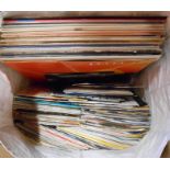 A quantity of LP records, 12" singles and 45s including Madness, Elton John, Paul McCartney, etc.