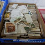 A box containing a large collection of sets and parts sets of cigarette cards including W.D & H.O.