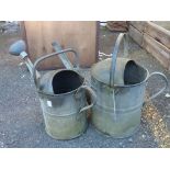 Two vintage watering cans