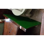 A vintage stained wood framed folding card table with green baize inset top