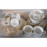 A Shelley bone china part tea set comprising six trios, milk and sugar, sandwich set and two bread