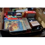 A box containing a quantity of vintage and modern games and puzzles including cribbage board, Jenga,