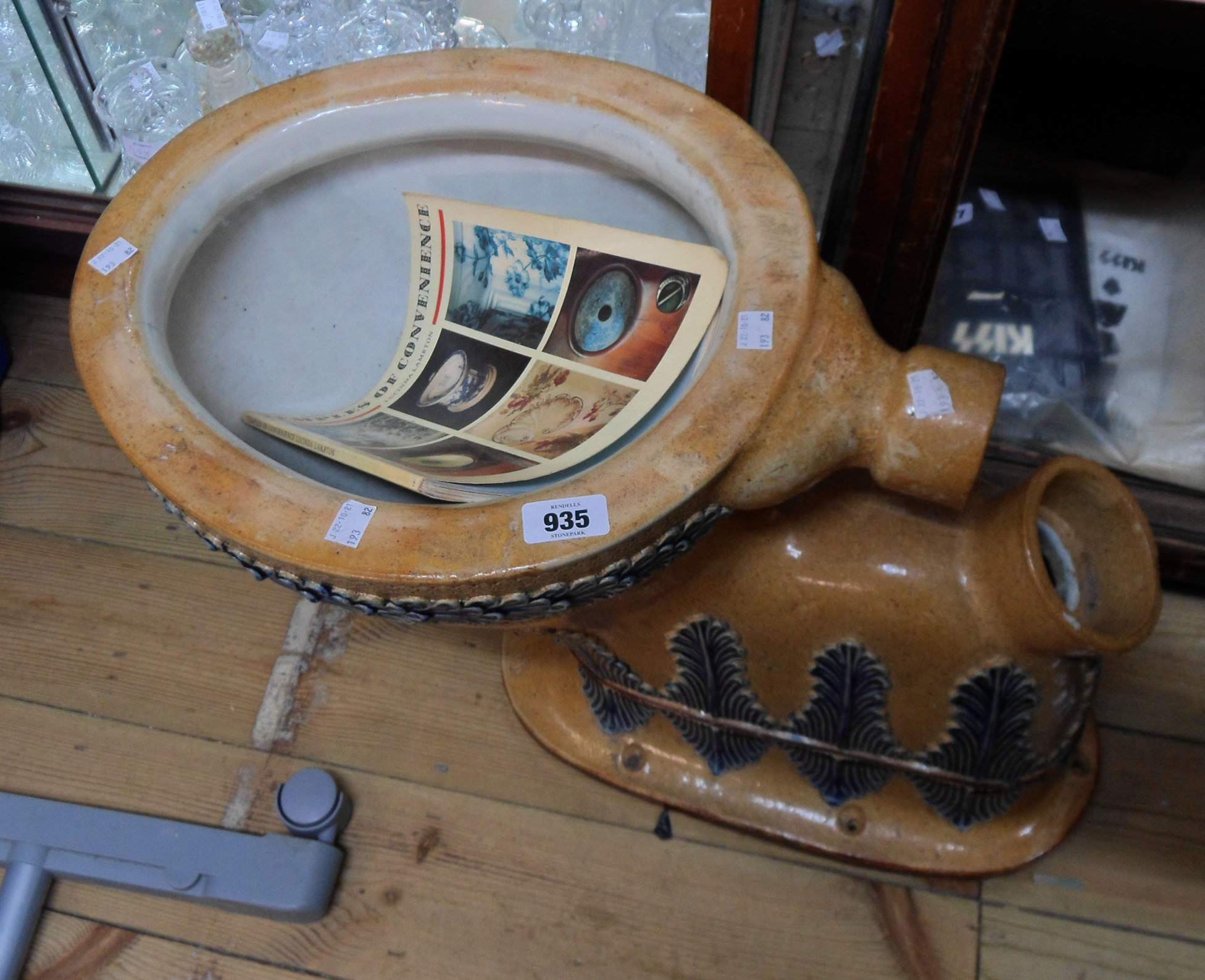 A Doulton Lambeth saltglazed stoneware toilet with decorative moulded acanthus leaf frieze and