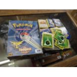A box containing a large quantity of Pokemon gaming trading cards in original Pokemon box