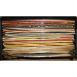 A record case containing a collection of LP records and 78rpm similar