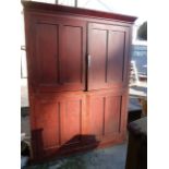 A Victorian pine double scullery cupboard with remains of original paint finish - old worm damage to