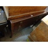 A 91cm Edwardian mahogany and strung dressing chest of three long drawers, set on square tapered