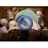 A box containing a quantity of ceramic items including commemorativeware plates, mugs, etc.