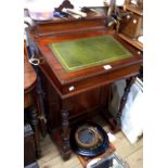 An Edwardian walnut Davenport with lift-top stationery compartment, inset slope, part fitted