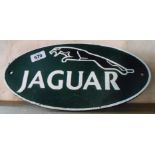 A modern cast metal painted Jaguar car sign