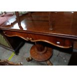 A 96cm Victorian mahogany fold-over tea table, set on faceted tapered pillar and circular platform