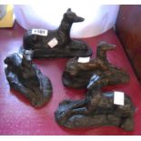 Four resin greyhound figurines with bronze effect finish