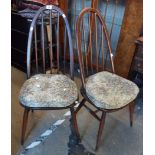 A pair of Ercol style elm stick back chairs in the dark finish