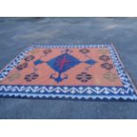 A vintage handmade kelim with central diamond motif within a repeating border - wear - 3.1 x 2.15m