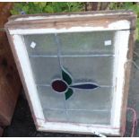 Two old window panels with leaded frosted and stained glass in a wooden frame