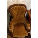 A Victorian mahogany part show frame spoon back drawing room armchair with button back upholstery,