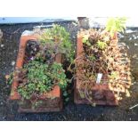 A pair of small terracotta troughs