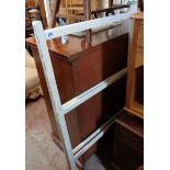 A vintage painted wood folding clothes airer
