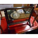 A 19th Century mahogany framed swing dressing table mirror with oblong plate, set on swept supports