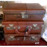 Three small vintage suitcases