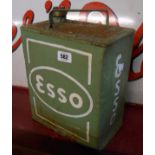 An old Esso petrol can with later painted highlighting