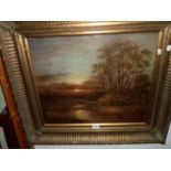 An ornate gilt framed oil on canvas, depicting a moonlit river landscape - unsigned - 49cm X 60cm