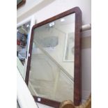 An antique mahogany framed wall mirror with rounded corners and oblong plate - from a dressing