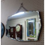 A vintage frameless bevelled octagonal wall mirror