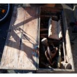 A wooden box containing assorted tools including planes, moulding planes, braces, etc.