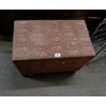 A vintage upholstered linen chest