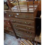 An 85cm retro polished mixed wood chest with flight of six long drawers, set on moulded tapered