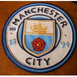 A modern painted cast metal Manchester City FC sign